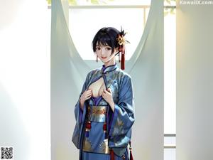 A woman in a green kimono sitting on a bed.