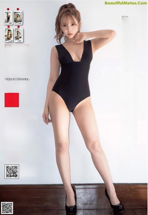 A naked woman laying on top of a bed.